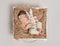 Adorable child napping with rabbit toy, topview