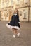 Adorable child wear classy uniform dress with elegant look in schoolyard, school