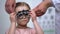 Adorable child wearing eye testing glasses to diagnose vision problems, optics