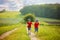 Adorable children, boy brothers, running in a field in the rural