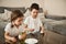 Adorable children holding eggs and paintbrushes ready for coloring Easter eggs