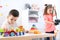 Adorable children playing in light room