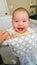 Adorable Chinese and Caucasian Baby Boy Playing In His Crib.