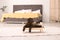 Adorable chocolate labrador retriever on toy bed