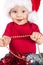 Adorable christmas child in a red hat