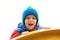 Adorable cute boy playing on playground on a cold day. Child wearing funny hat and red jacket. Funny little boy outdoors. Kids out
