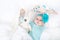 Adorable cute newborn baby girl with turquoise flower headband with Easter bunny