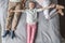 Adorable daughter with mother and father relaxing on bed at home