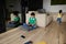 Adorable diverse Caucasian kids in the children`s room. Adorable teenage school boy reading book, while sitting at the sofa in hi