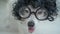 Adorable dog face in afro style black curls hair wig and nerd round glasses