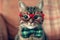 Adorable Feline Donning Stylish Red Glasses And A Charming Green Bowtie Standard