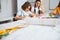 Adorable female children working in sewing workshop