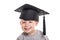 Adorable four years old child boy wearing a mortar board.