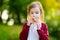 Adorable girl holding clay whistle