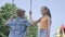 Adorable girl with long hair swinging on a swing cute boy outdoors. Couple of happy children. Funny carefree kids in