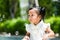 Adorable girl playing bubble blower