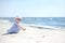 Adorable girl on a sunny sand beach