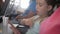 Adorable girl traveling by an airplane and using a digital tablet during the flight. Concept traveling abroad with kids.