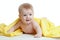 Adorable happy baby in yellow towel