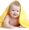 Adorable happy blue-eyed baby in yellow towel