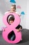 adorable happy kids posing with decorative pink number eight