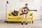 adorable happy little boy playing guitar