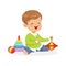 Adorable happy little boy sitting on the floor playing with toys, colorful character vector Illustration