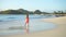 Adorable happy little girl on white beach walking and enjoying her holidays