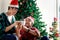 Adorable happy smiling young LGBT couple sharing special moment together on Christmas holiday, Asian gay male lover sitting on