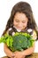 Adorable healthy little girl holding salad bowl