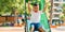 Adorable hispanic boy smiling happy playing at the park