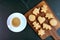 Adorable Homemade Animal and Heart Shaped Cookie with a Cup of Coffee on Black Table