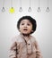 Adorable Intelligent Little Boy Thinking - Idea Bulbs