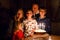 Adorable kid boy celebrating tenth birthday. Toddler Baby child, two kids boys brothers, mother and father together with