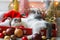 Adorable kitten sleeping on cozy santa hat with red and gold baubles in festive lights