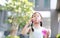 Adorable little Asian kid girl play bubbles in garden outdoor