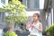 Adorable little Asian kid girl play bubbles in garden outdoor