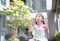 Adorable little Asian kid girl play bubbles in garden outdoor