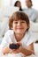 Adorable little boy watching TV lying on the floor