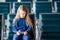 Adorable little girl in airport near big window indoor