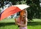 Adorable little girl with colored umbrella