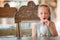 Adorable little girl drinking milkshake