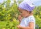 Adorable little girl eating berries