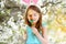 Adorable little girl eating colorful gum candies on Easter