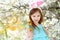 Adorable little girl eating colorful gum candies on Easter