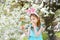 Adorable little girl eating colorful gum candies on Easter