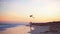 Adorable little girl with flying kite on tropical beach. Kids play on ocean shore. Child with beach toys.