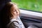 Adorable little girl going on vacations and traveling by railway.