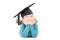 Adorable little girl with graduation hat laying down and daydreaming