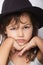 Adorable little girl in the hat closeup portrait